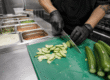 Fresh Persian cucumbers prepared in a foodservice kitchen for efficient use