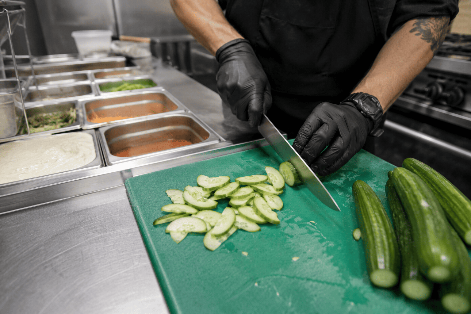 Fresh Persian cucumbers prepared in a foodservice kitchen for efficient use