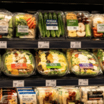 Persian cucumbers displayed in grab-and-go retail foods at a grocery store