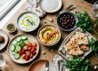 Fresh Persian cucumbers served with tzatziki, hummus, and traditional Mediterranean dishes